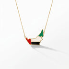 UAE map necklace in 18K gold with UAE flag enamel fill — red, white, black and green — by ROKO Jewelers Dubai