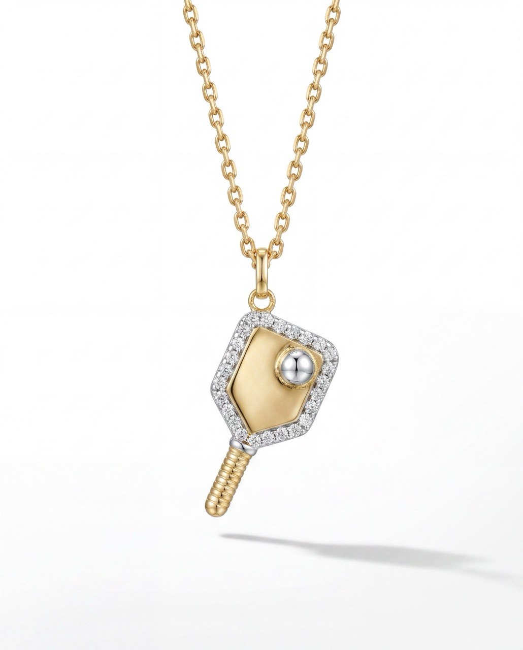 Gold and silver pendant necklace on a white background