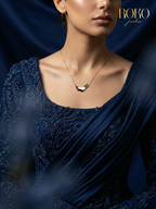 UAE map necklace in 18K gold with UAE flag enamel fill — red, white, black and green — by ROKO Jewelers Dubai