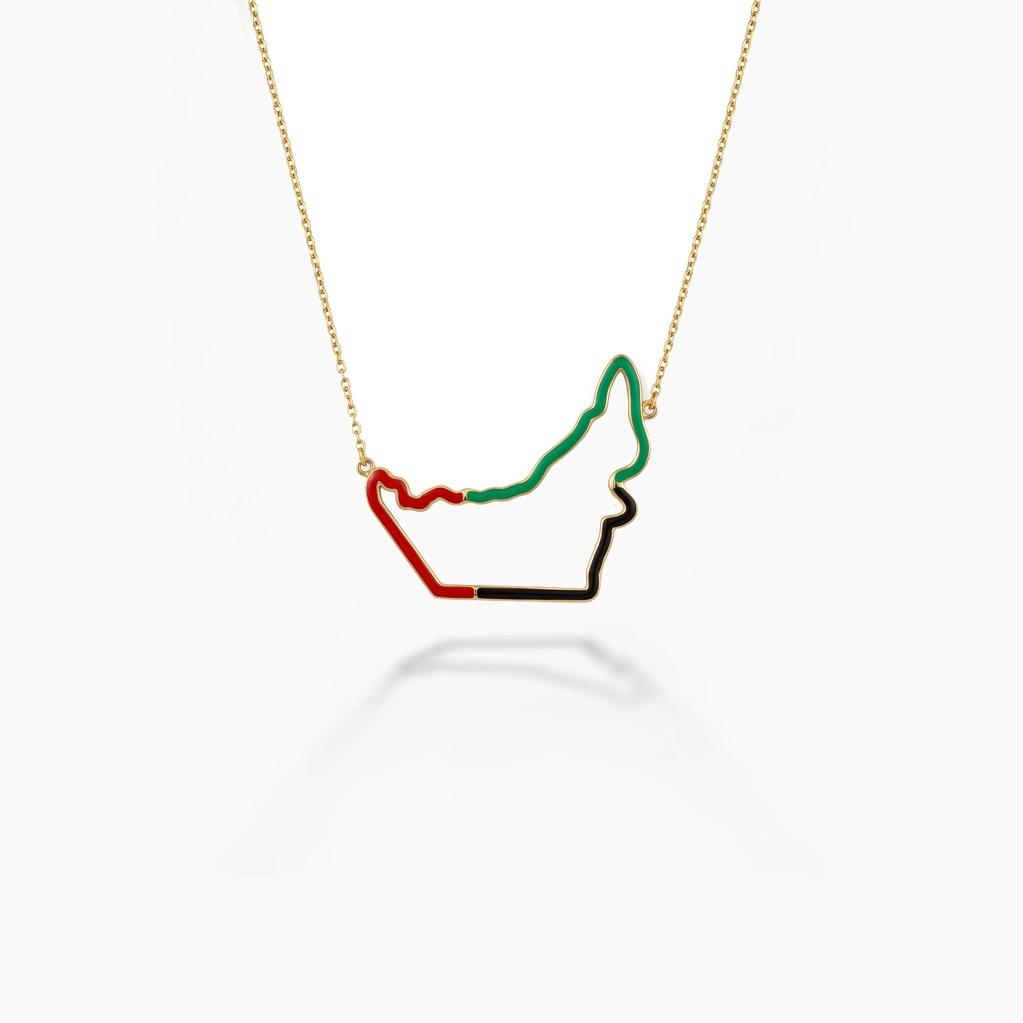 UAE flag outline necklace in gold — subtle enamel border design, white background